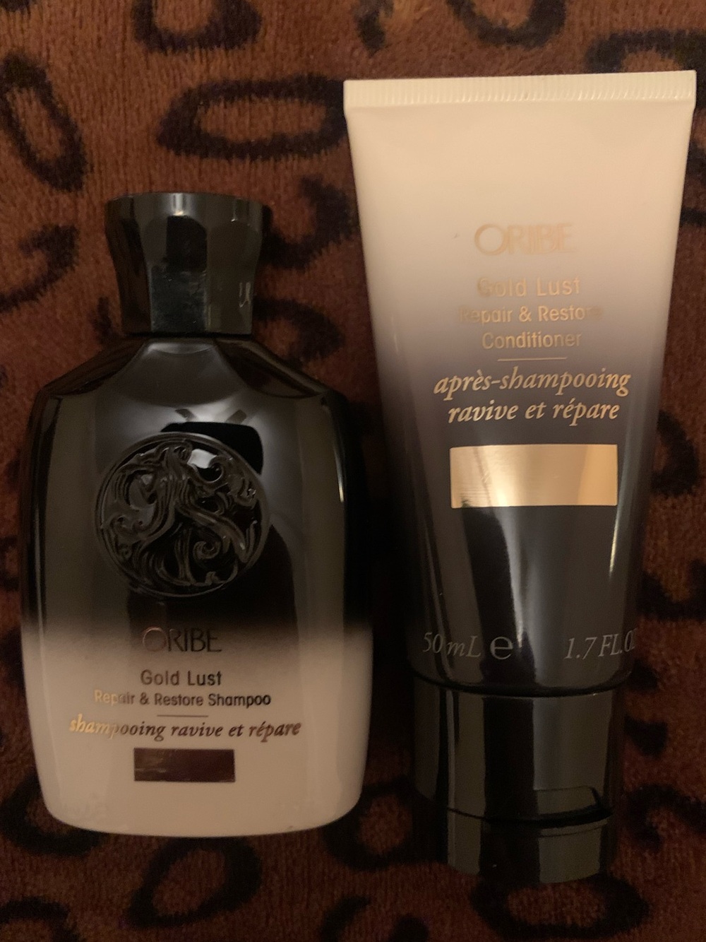 Oribe Gold Lust Repair & Restore Shampoo and Conditioner Travel Size.